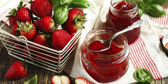 Fresh strawberries and basil leaves