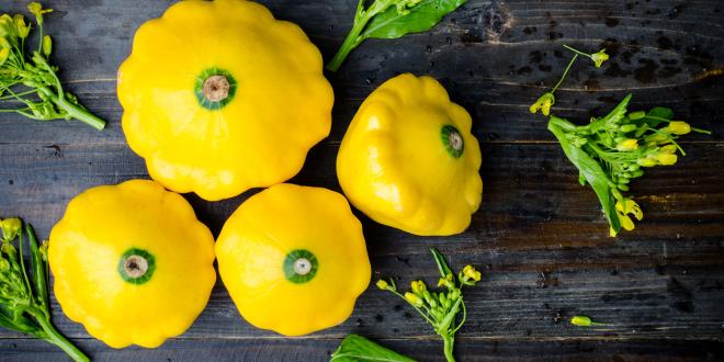 Yellow patty pan squash on a table