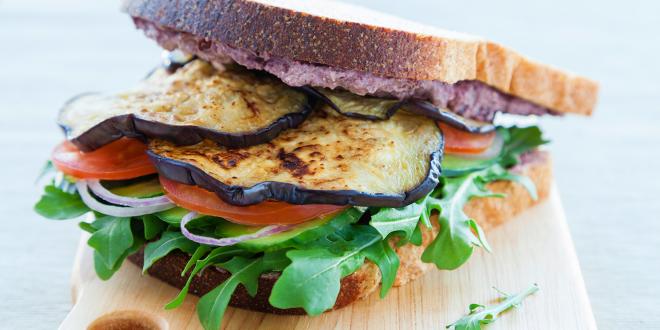 grilled eggplant on bread with crumbled cheese