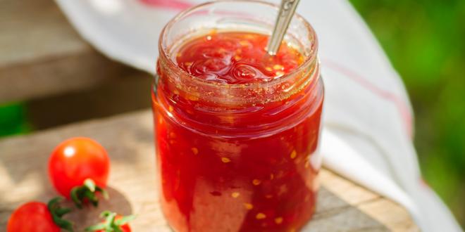 a mason jar full of reduced tomatoes