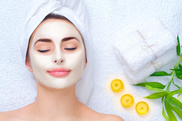 a woman enjoying a relaxing facial mask