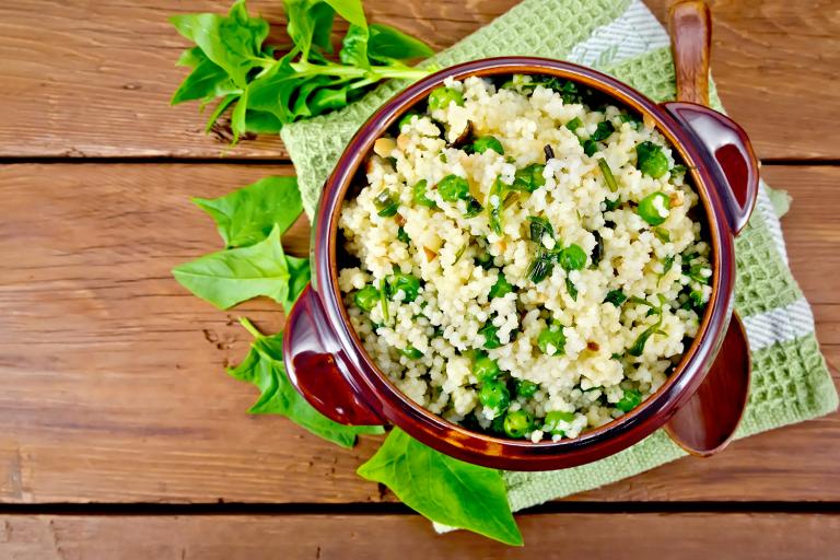 a bowl of couscous with peas